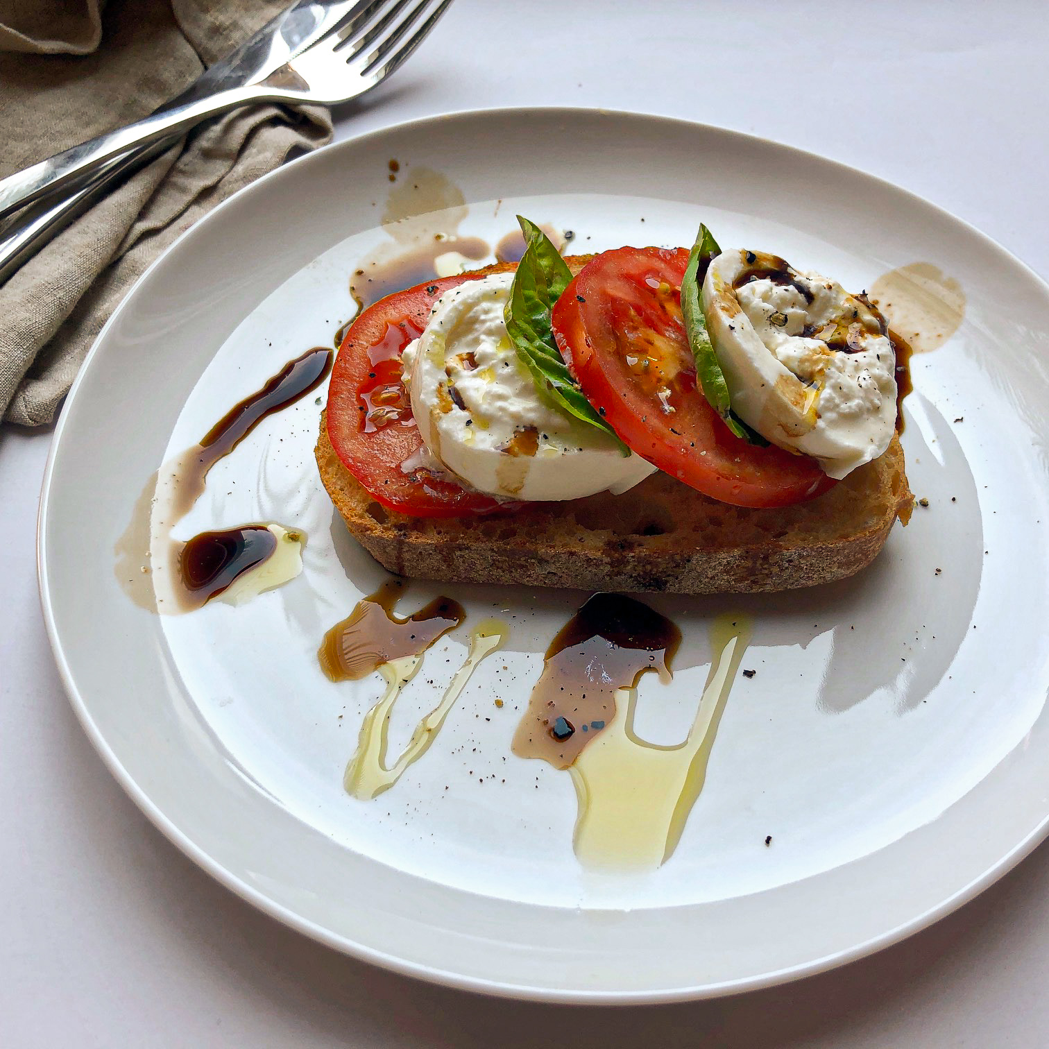 Caprese toast with burrata and basil