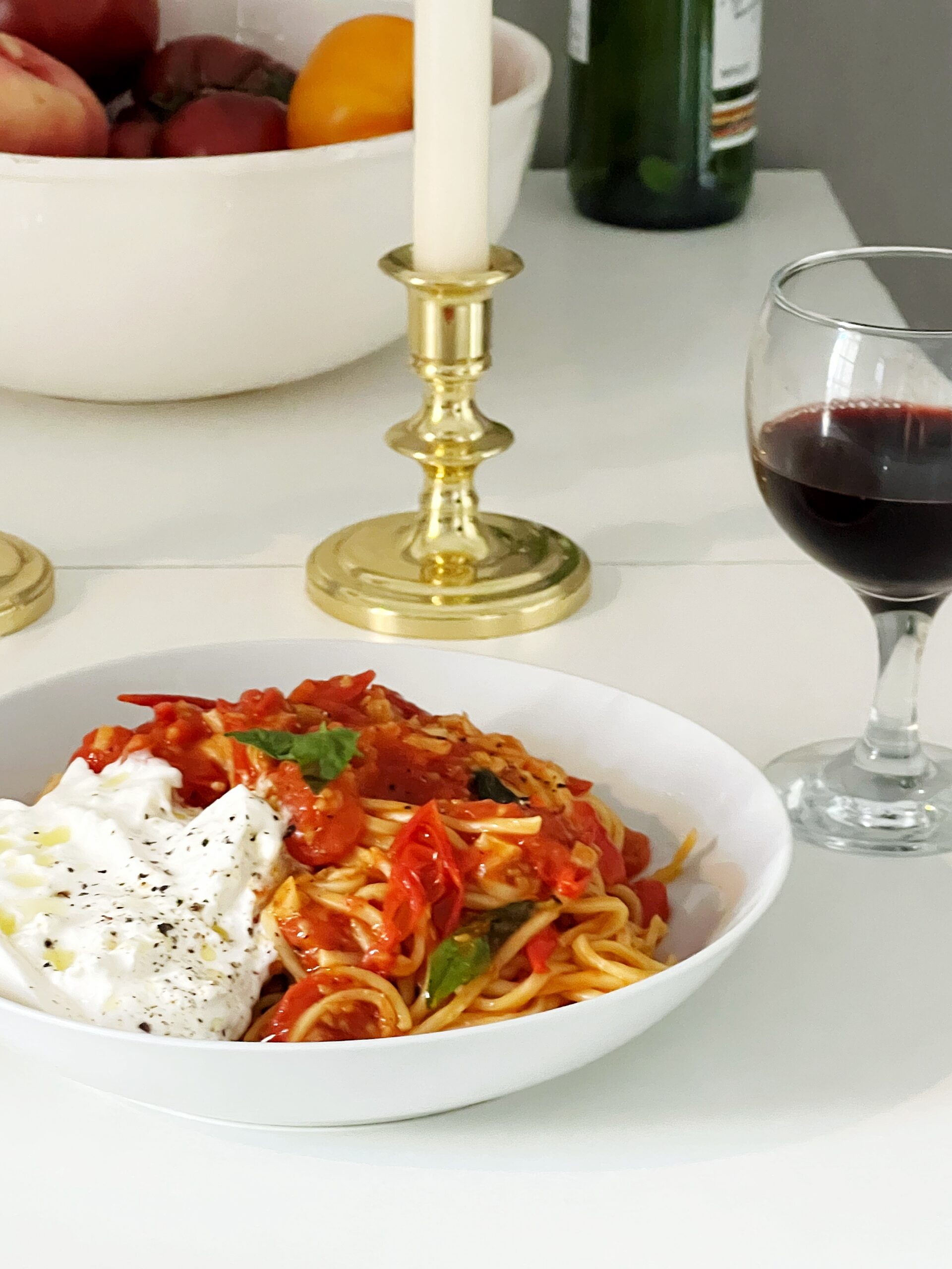 spaghetti with pomodoro sauce and burattam paired with a glass of italian red wine