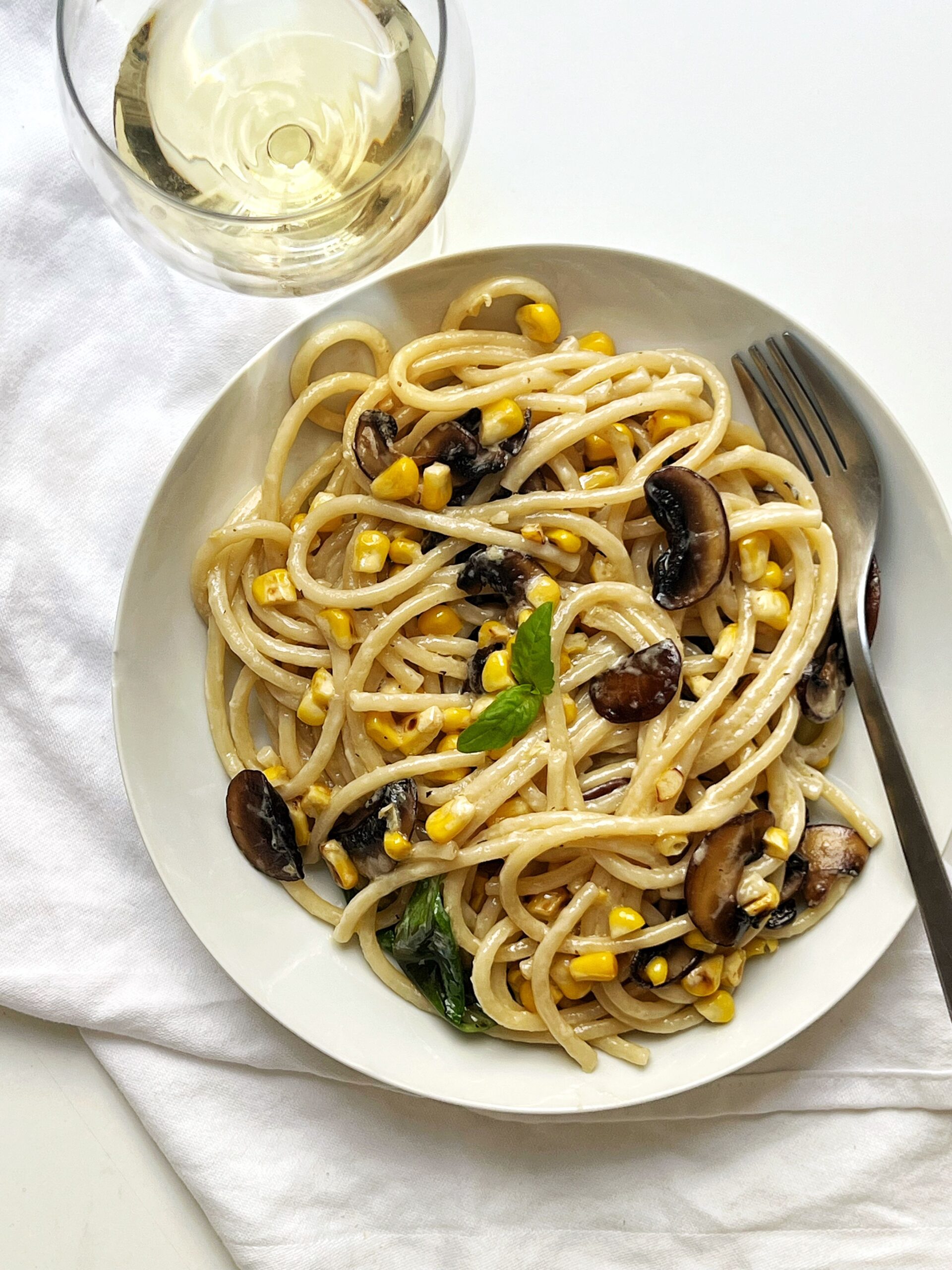 corn and mushroom pasta with basil and white wine