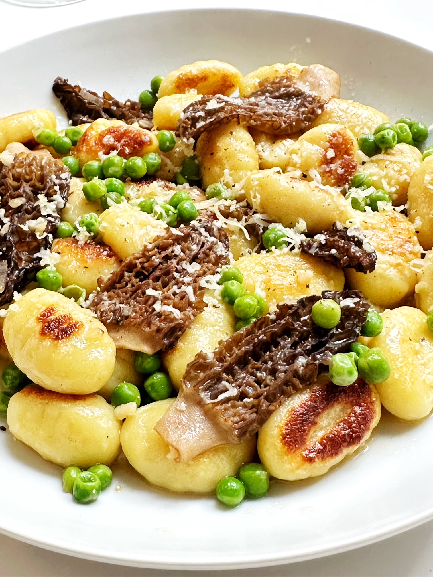 seared gnocchi with morels and english peas